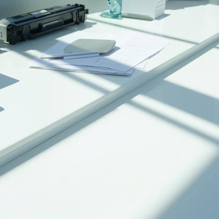 bright office desk with organized supplies and tech in a clean, modern setting